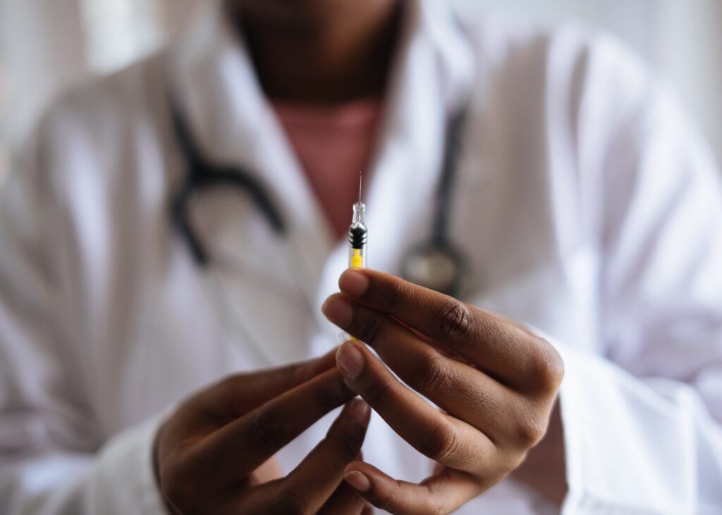 A veterinarian preparing a vaccine